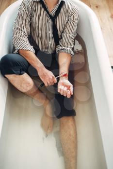 Businessman bankrupt slit his wrists in bathtub, suicide man concept. Problem in business, stress