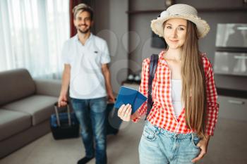 Young couple with suitcases went on a journey. Fees on vacation concept. Luggage preparation. Travelling or tourism