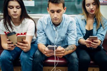 Modern youth using phones in subway, addiction problem, social addicted people, modern underground life