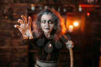 Scary witch hands out, front view, spiritual seance. Female foreteller calls the spirits, fortune teller