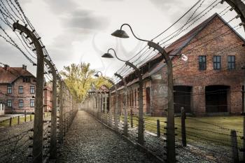 Barracks and barbed wire fence, territory of German prison Auschwitz II, Birkenau, Poland. Museum of victims of the nazi genocide of the Jewish people