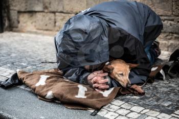 The beggar with dog begging for alms, European city. Summer tourism and travels, famous europe landmark, popular places and streets