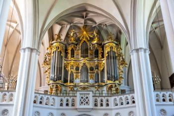 Organ in the Cathedral of old European town. Summer tourism and travels, famous europe landmark, popular places and streets