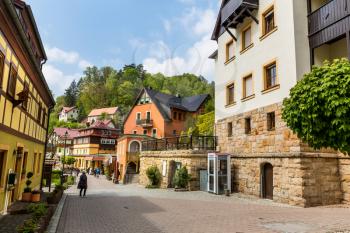 Germany, provincial town street in mountains with green forest. Buildings in old european style, German architecture