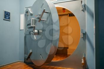 Bank security system, opened vault door, safety and reliable protection, nobody. Depository entrance, secure and complex lock