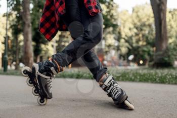 Roller skating, male skater rolling in park. Urban roller-skating, active extreme sport outdoors