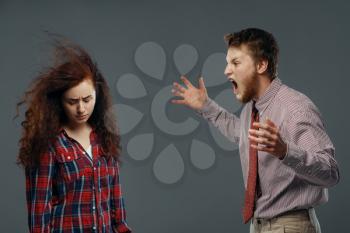 Man shouts on woman like strong wind blowing in face, emotion concept. Male person screams, powerful air flow blows on girl, black background