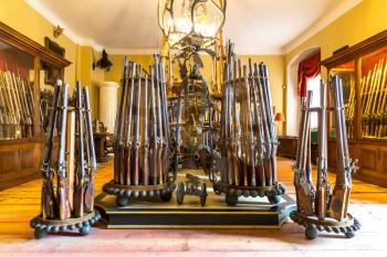 Museum with old weapons, ancient armory storage, Europe. Medieval european guns, famous places for travel and tourism