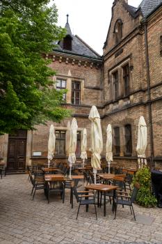 Street cafe in ancient European town, nobody. Summer tourism and travels, famous europe landmark, popular places