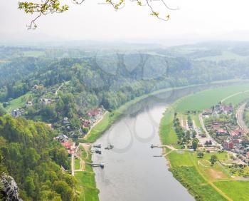 Germany, provincial town in green forest on Elbe river, view from mountain. Buildings in old european style, German landscapes