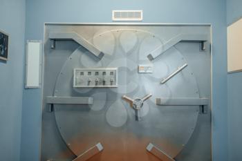 Bank security system, vault door with locks, safety and reliable protection, nobody. Closed depository entrance