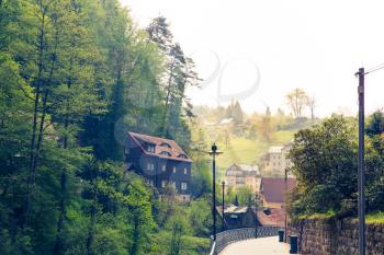 Germany, provincial town in mountains with green forest. Buildings in old european style, German architecture