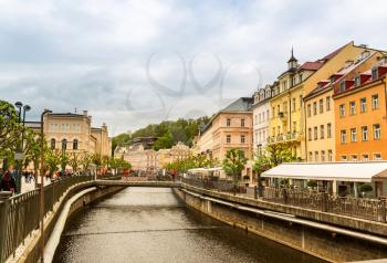 River and stone pedestrian bridge, Karlovy Vary, Czech Republic, Europe. Old european town, famous place for travel and tourism