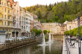 City river and outdoor cafes, Karlovy Vary, Czech Republic, Europe. Old european town, famous place for travel and tourism