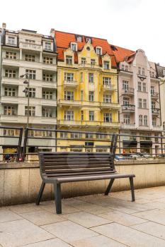Bench on the street with granite tiles, Karlovy Vary, Czech Republic, Europe. Old european town, famous place for travel and tourism
