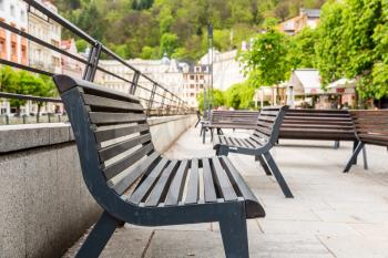 Benches on a tourist street, Karlovy Vary, Czech Republic, Europe. Old european town, famous place for travel and tourism