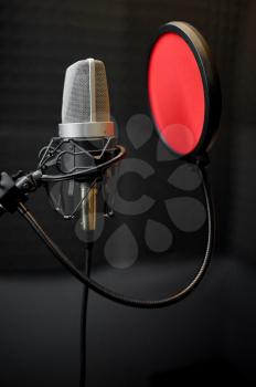 Professional microphone closeup, recording studio equipment, nobody. Audio, sound and music record in best quality