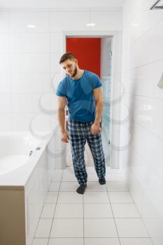 Hangover man in bathroom. Hungover male person, headache and depression, bad morning