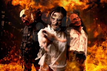 Zombies with bloody skinned faces, nightmare, explosions and fire on background. Horror in city, creepy crawlies attack, apocalypse
