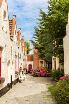 Cozy yard in ancient provincial European town. Traditional architecture. Summer tourism and travels, famous europe landmark, popular places for travelling