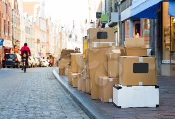 Carton garbage boxes on sidewalk, european city. Full trashbox on the street in Europe, nobody, trashcan
