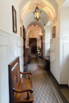 Corridor interior with vintage furniture, Europe. Ancient european architecture and style, famous places for travel and tourism, historical heritage, museum