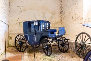 Vintage carriage in museum, old vehicle, Europe. Traditional european architecture, famous places for tourism and travel, historical heritage