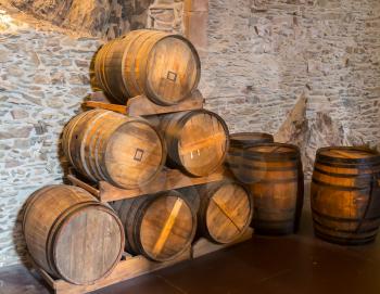 Ancient castle, wooden barrels in winery room, old Europe. Traditional european architecture, famous places for tourism and travel, medieval technologies