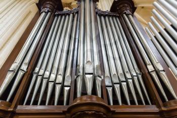 Organ pipes bottom view, antique musical instrument in cathedral church, Europe. European famous places for tourism and travel