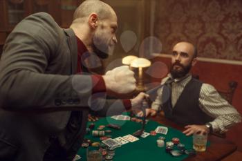 Poker player caught the sharper in casino, risk. Games of chance addiction. Men with whiskey and cigars in gambling house