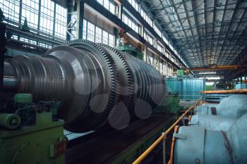 Turbine manufacturing factory, gears, nobody. Power machines, plant interior on background, industrial machinery