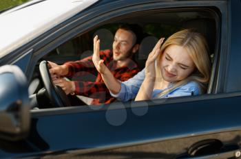 Lady and male instructor in car, accident situation, driving school. Man teaching a woman to drive vehicle. Driver's license education
