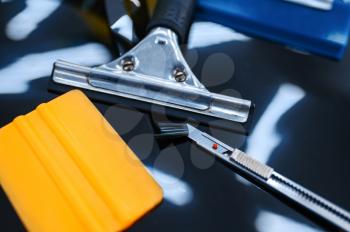 Tools for car tinting closeup, nobody, vehicle tuning service. Equipment for vinyl tint installation, business concept