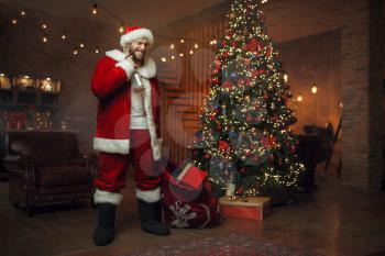 Bad drunk Santa claus brings gifts, nasty party. Unhealthy lifestyle, bearded man in holiday costume, new year and alcoholism