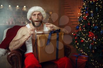 Bad Santa claus takes drugs, nasty cocaine party, humor. Unhealthy lifestyle, bearded man in holiday costume