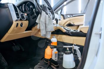 Car interior and tools for dry cleaning, detailing. Vehicle washing, thoroughly care of automobile, chemical and vacuum clean service
