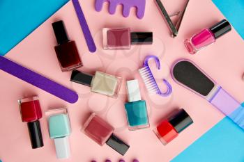 Nail care products, colorful polish in bottles on pink background, nobody. Healthcare procedures concept, fashion cosmetic, manicure and pedicure tools, fingernail varnish