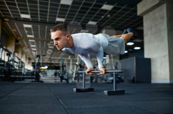 Sportive man doing abs exercise, fitness training in gym. Athletic male person on workout, sportsman in sport club, active healthy lifestyle, physical wellness