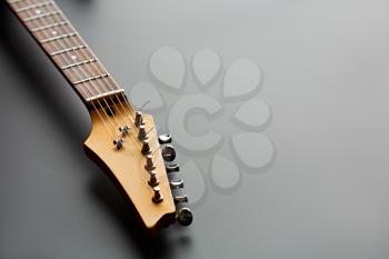 Electric guitar, closeup view on head. String musical instrument, electro sound, electronic music, equipment for stage concert