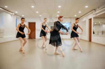 Teacher and young ballerinas, performance in class. Ballet school, female dancers on choreography lesson, girls practicing grace dance
