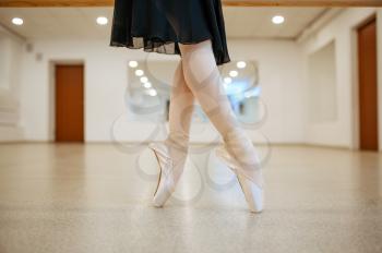 Teen ballerina legs, dance performing in class. Ballet school, female dancers on choreography lesson, girl practicing stretching exercise