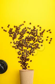 Coffee bean flowers isolated on yellow background, top view. Organic vegetarian food, grocery assortment, natural eco products, healthy lifestyle concept