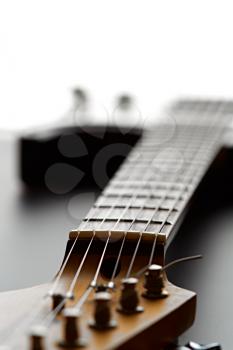 Electric guitar, closeup view on head, nobody. String musical instrument, electro sound, electronic music, equipment for stage concert