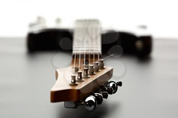 Electric guitar, fosuc view on head, closeup, nobody. String musical instrument, electro sound, electronic music, equipment for stage concert