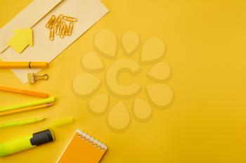 Office stationery supplies, macro view all in yellow tones. School or education accessories, writing and drawing tools