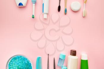 Oral care products, pink background, nobody. Morning healthcare procedures concept, toothcare, different toothbrushes and toothpaste