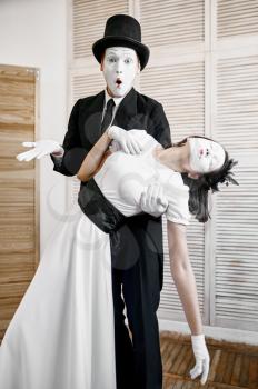 Two mime artists, parody, comedy performance. Pantomime theater, comedian, positive emotion, humour performance, funny face mimic and grimace