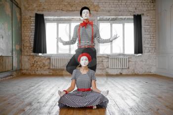 Two mime artists, love couple parody scene, comedy. Pantomime theater, comedian, positive emotion, humour performance, funny face mimic and grimace