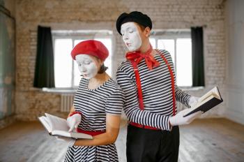Mime artists, scene with books, student parody comedy. Pantomime theater, comedian, positive emotion, humour performance, funny face mimic and grimace
