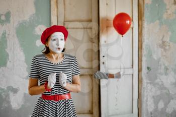 Male and female mime artists, scene with air balloon, parody comedy. Pantomime theater, comedian, positive emotion, humour performance, funny face mimic and grimace